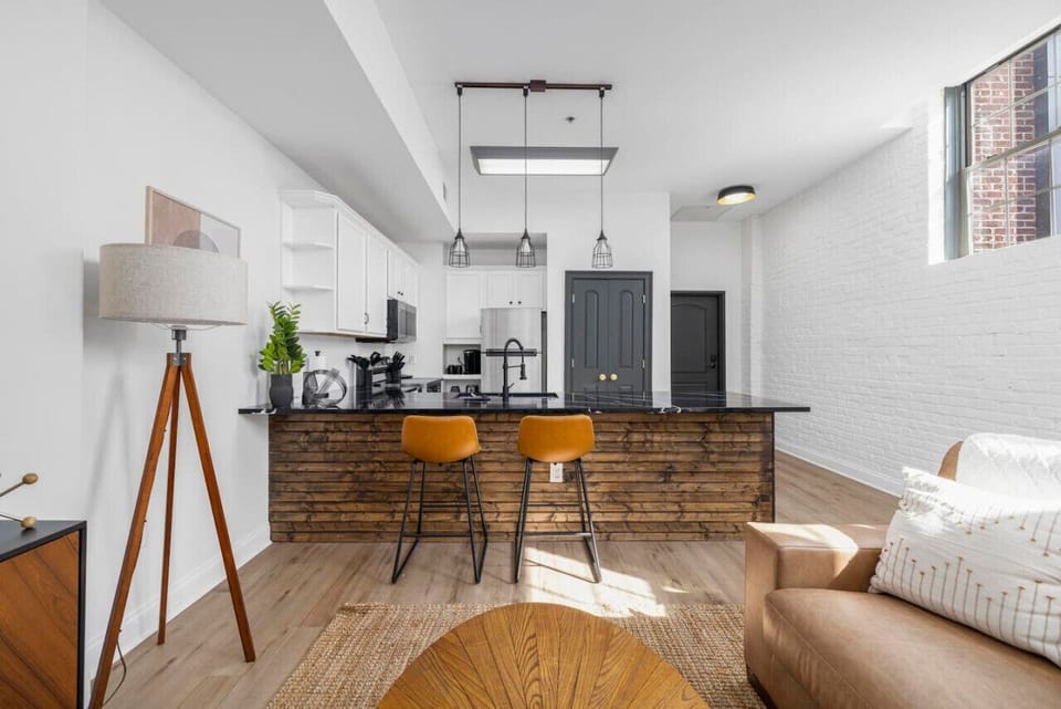 Pull up a seat at the sleek bar and enjoy a casual meal or a morning coffee with a view of the open living space.