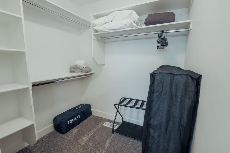 Primary Closet - with pack n play & extra rollaway twin bed