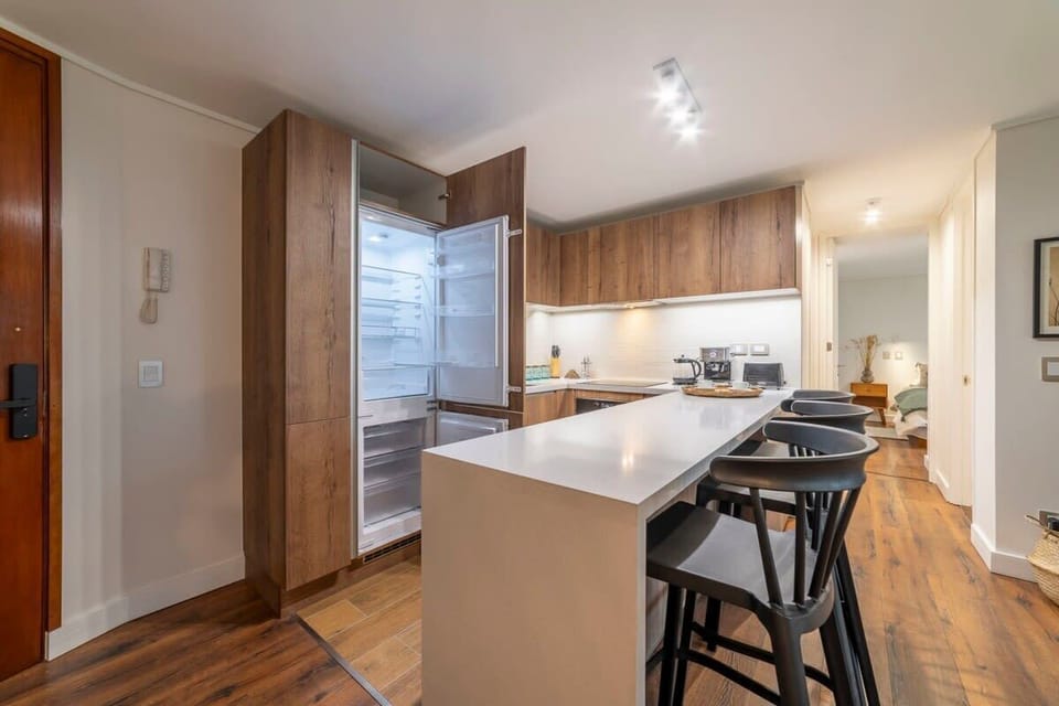 Sleek and modern kitchen with ample space and amenities, perfect for cooking and entertaining.