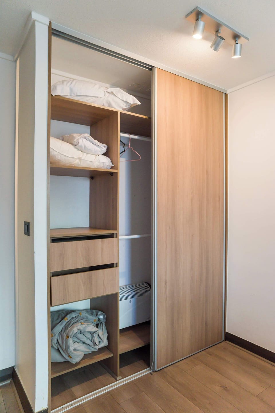 Spacious wardrobe with ample storage and fresh linens for your comfort.