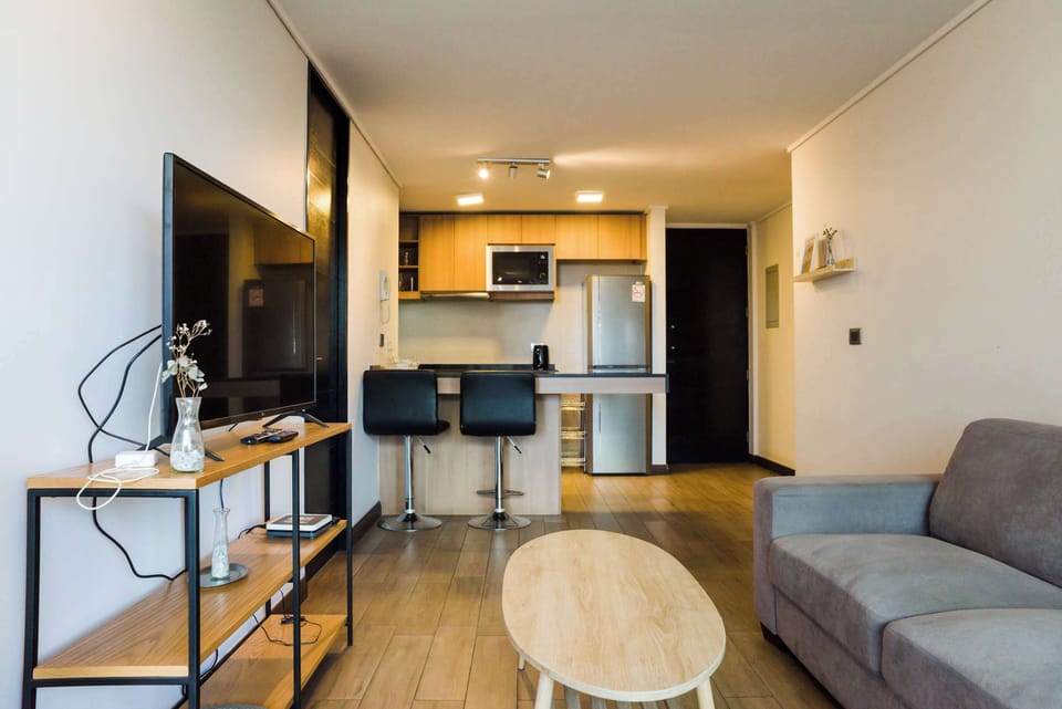 Relax in this cozy living space with modern amenities and a fully equipped kitchen, perfect for unwinding after a day of exploring.
