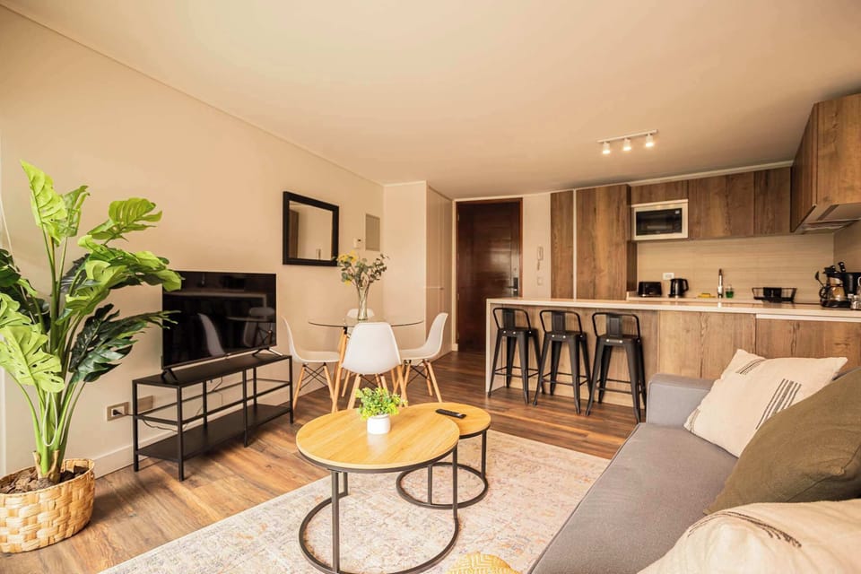 Chic and cozy open-plan living area with modern amenities, perfect for relaxing or entertaining in style.