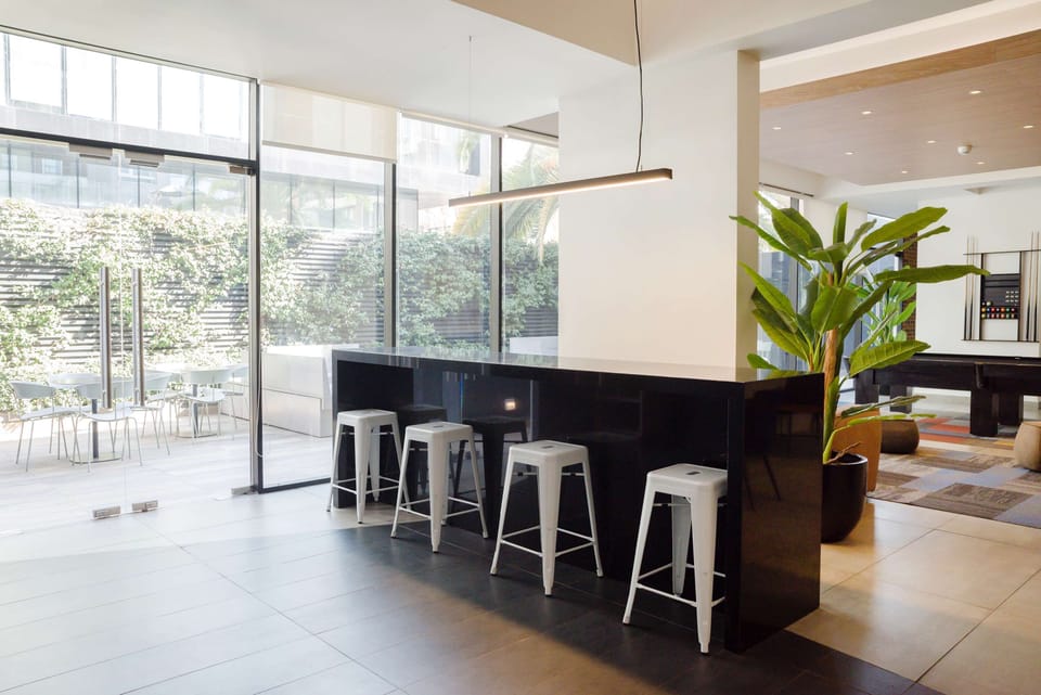 Enjoy a stylish communal lounge with natural light, perfect for relaxation or socializing.