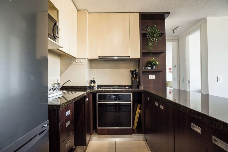 Modern kitchen with sleek design and ample storage, perfect for cooking and entertaining.