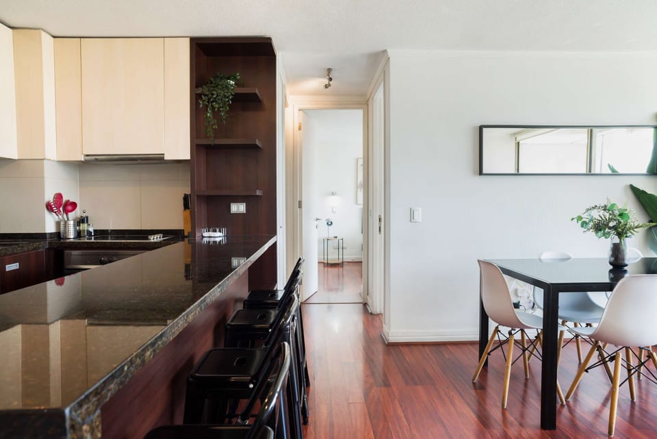 Sleek kitchen with granite countertops and a cozy dining area, perfect for enjoying meals together.