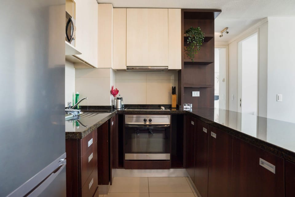 Modern kitchen with sleek appliances and ample counter space, perfect for culinary enthusiasts.
