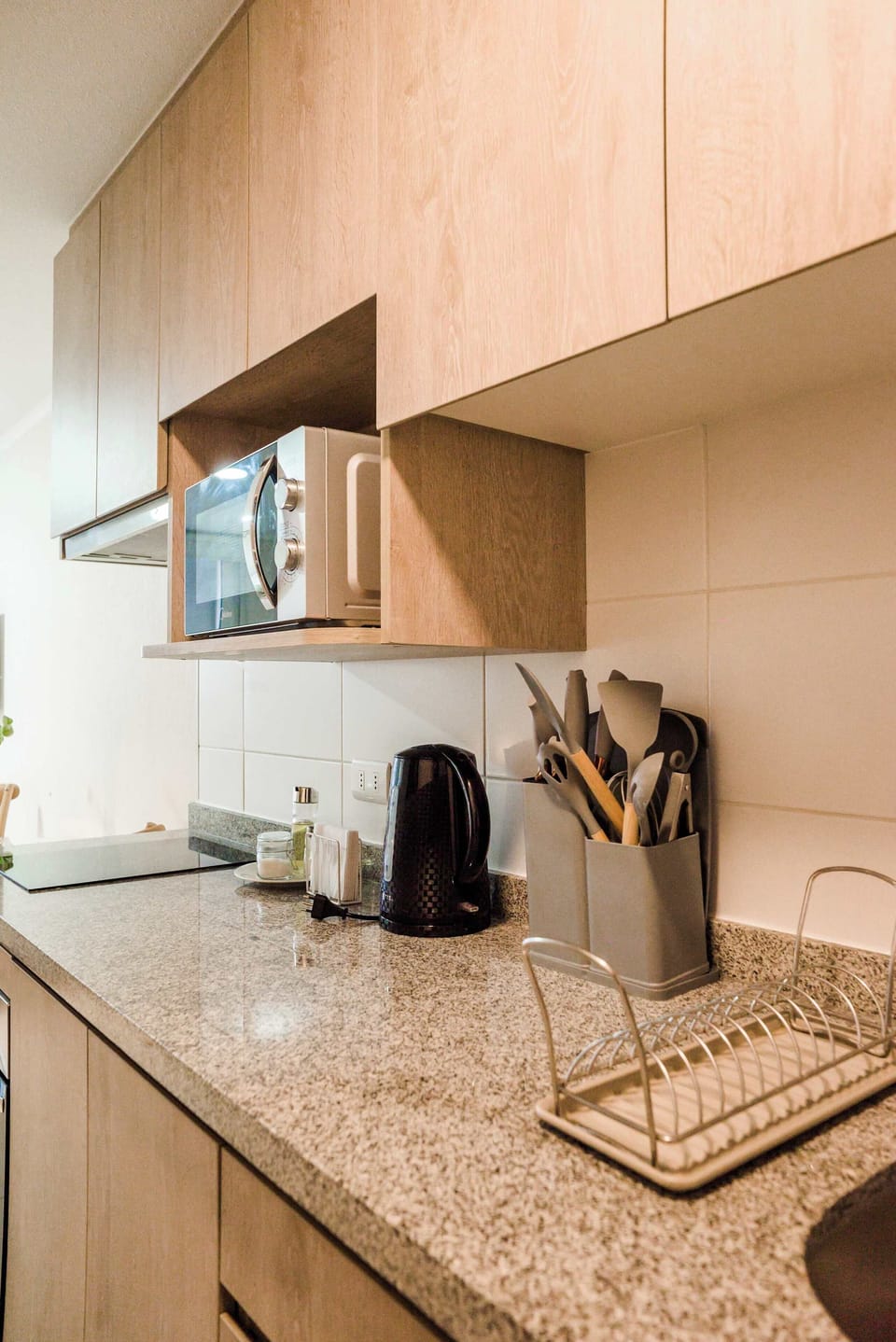 Modern kitchenette with essential amenities for a comfortable stay in the heart of the city.