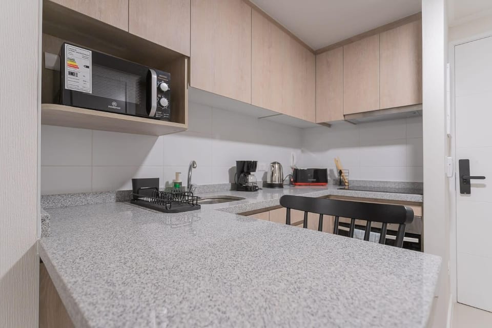 Modern kitchen with sleek appliances and ample counter space, perfect for preparing your favorite meals.