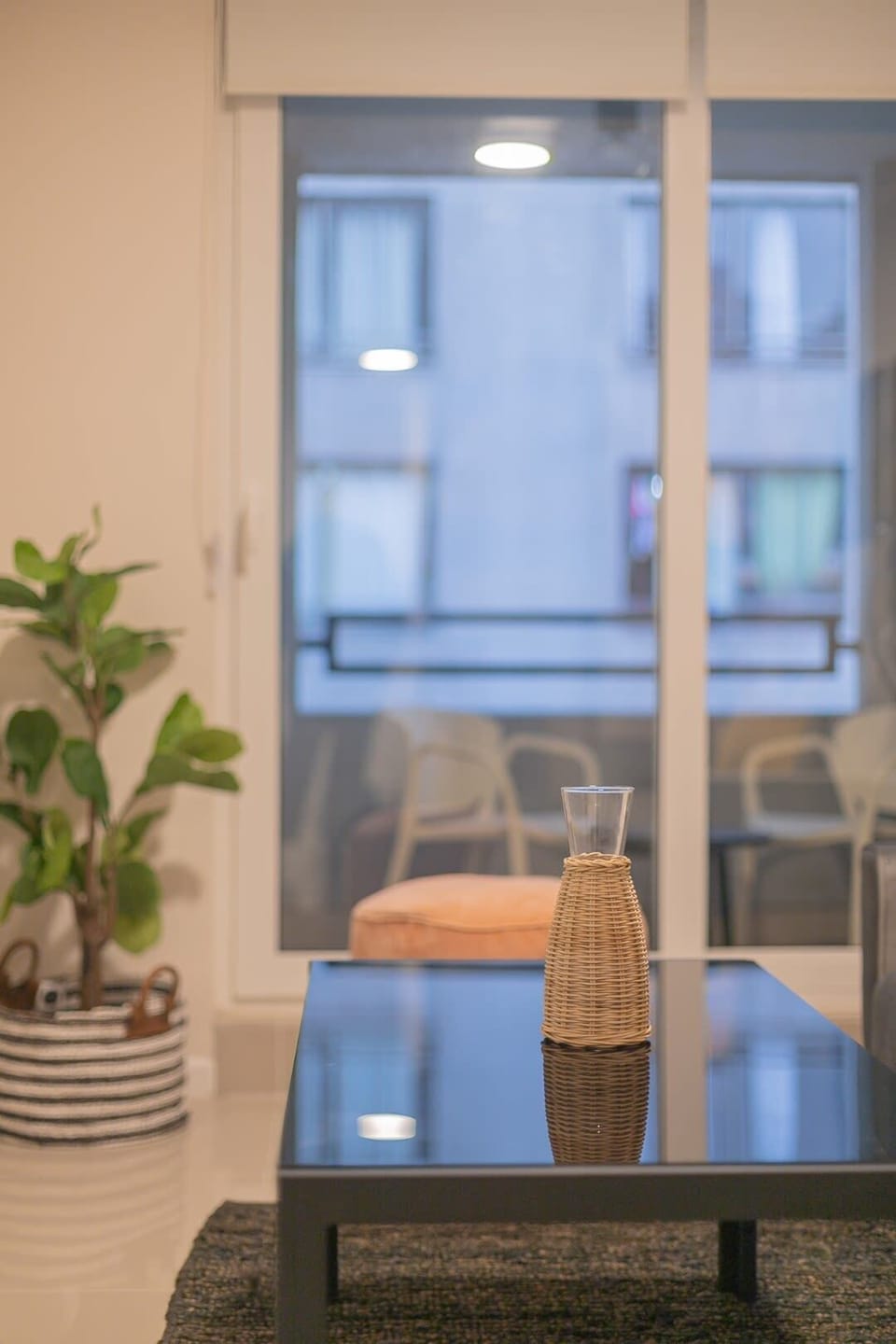 Elegant decor with a stylish coffee table and a view of the balcony.