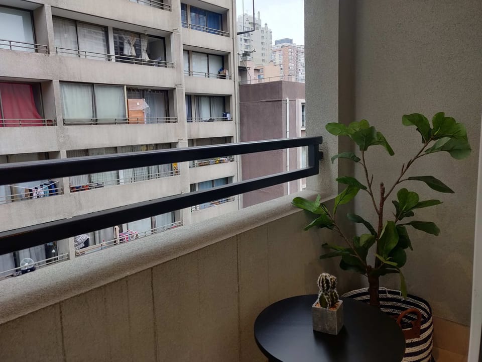 Cozy private balcony with city views, perfect for a morning coffee or evening relaxation.