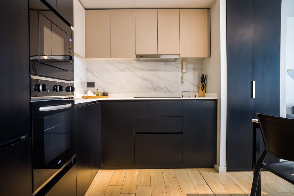 Sleek, modern kitchen with high-end appliances and stylish design, perfect for cooking enthusiasts.