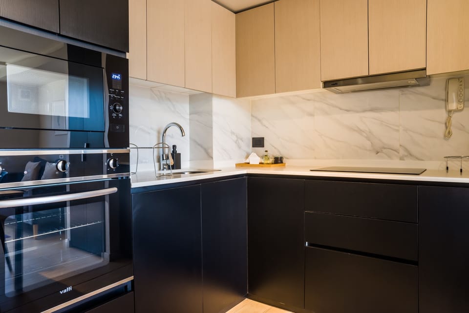 Sleek and modern kitchen with high-end appliances, perfect for cooking your favorite meals in style.