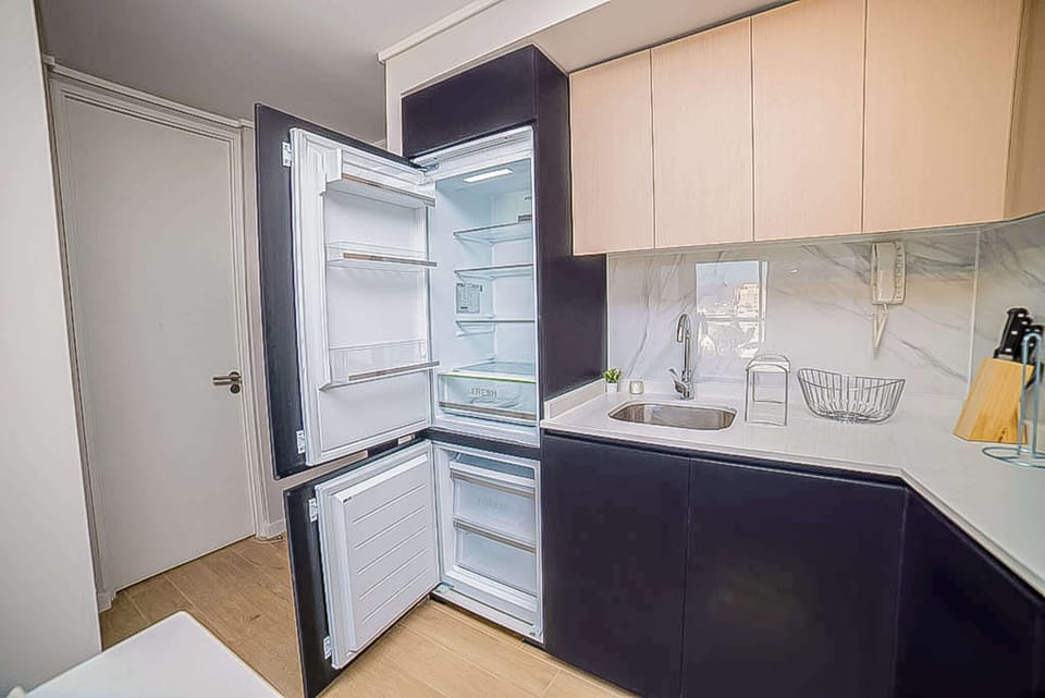 Sleek and modern kitchen with ample storage and stylish design, perfect for culinary adventures.