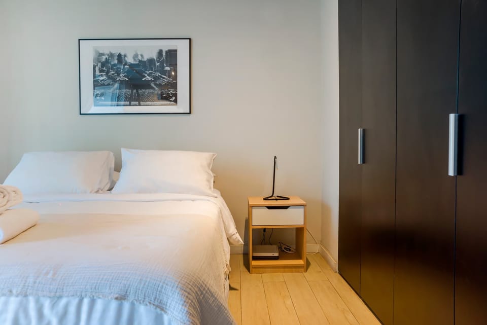 Cozy and inviting bedroom with ample storage and modern decor, perfect for a restful stay.
