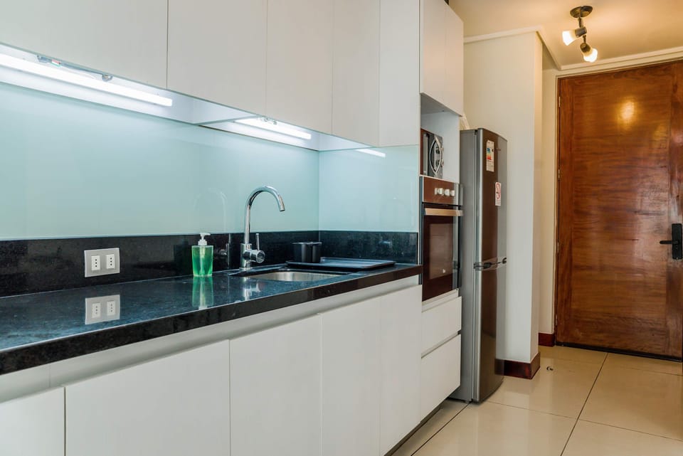 Sleek and modern kitchen with high-end appliances, perfect for cooking your favorite meals.