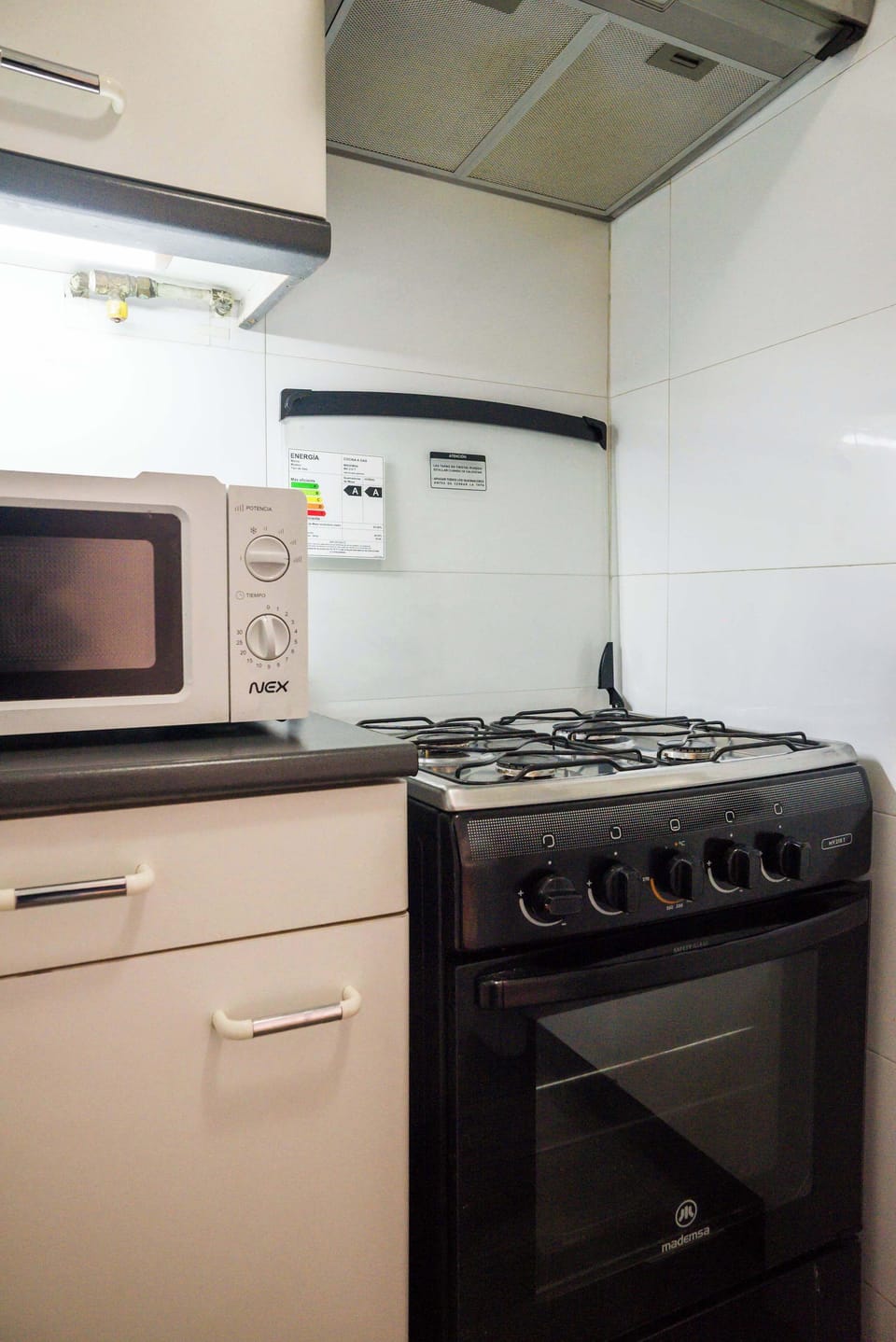 Cozy kitchen corner equipped with essential appliances for your culinary needs.