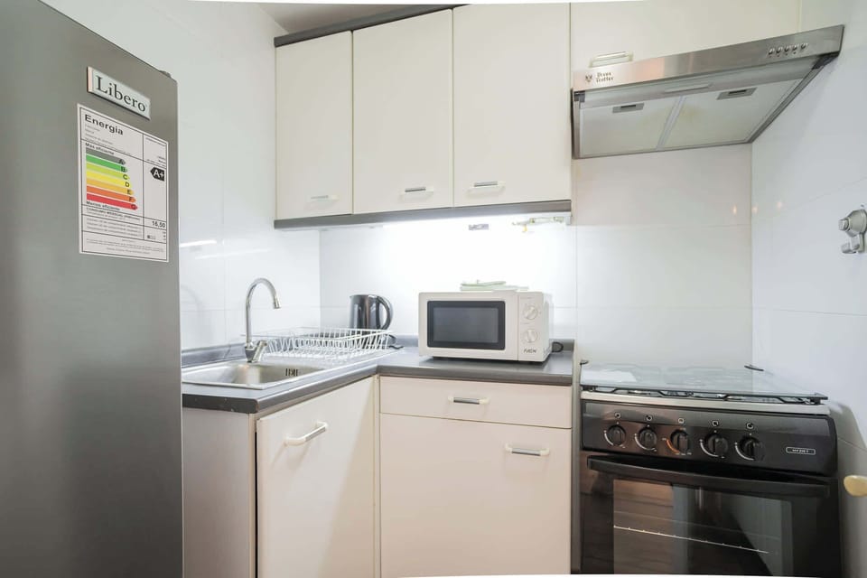 Modern and fully equipped kitchen with all essentials for a comfortable stay.