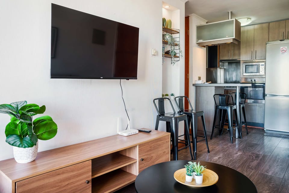 Enjoy a cozy living space with modern amenities and a stylish kitchen, perfect for relaxing or entertaining.