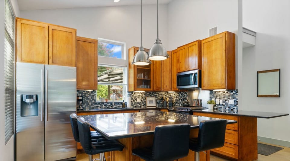 Fully equipped kitchen with all the essentials plus dishwasher, and island seating
