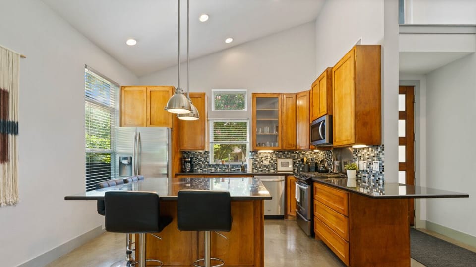 Fully equipped kitchen with all the essentials plus dishwasher, and island seating
