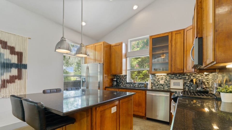 Fully equipped kitchen with all the essentials plus dishwasher, and island seating