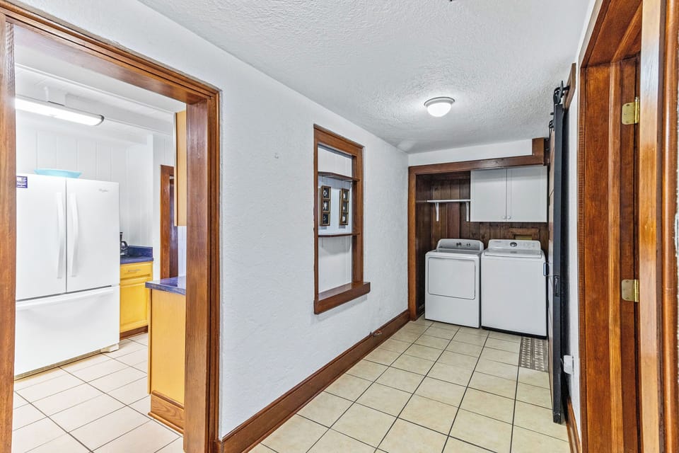 Entryway and Laundry - This entry way is spacious and functional here you can access the laundry room, bathroom and store your things.