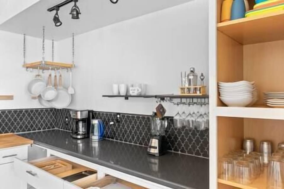 Open shelving stocked with cookware