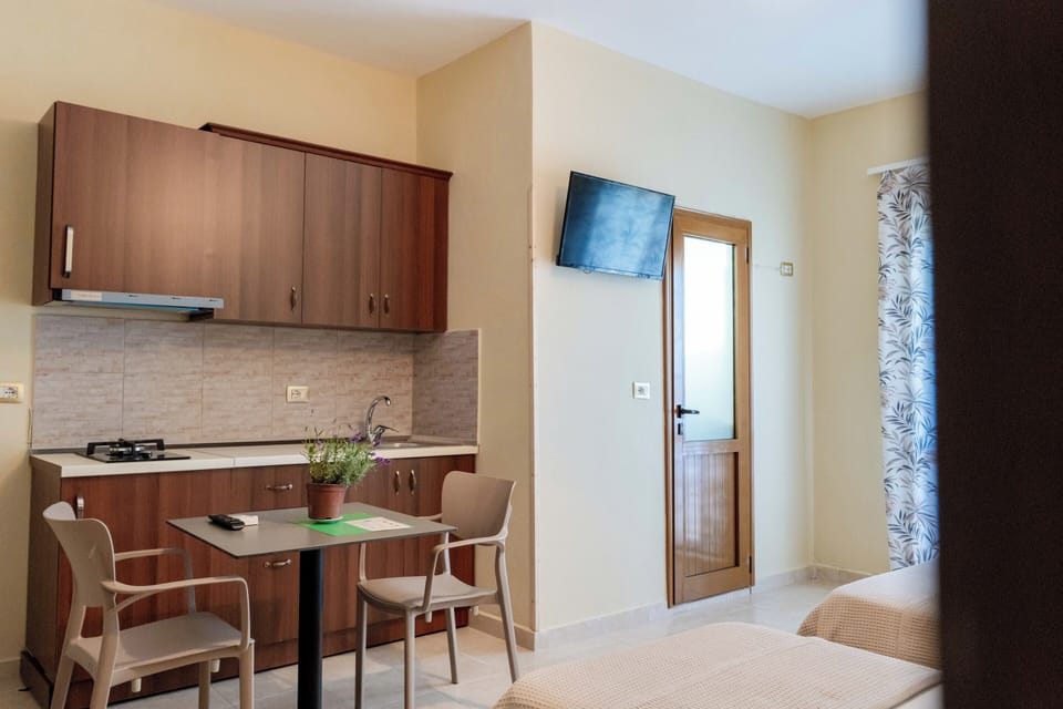 Triple Room, Balcony | Private kitchen