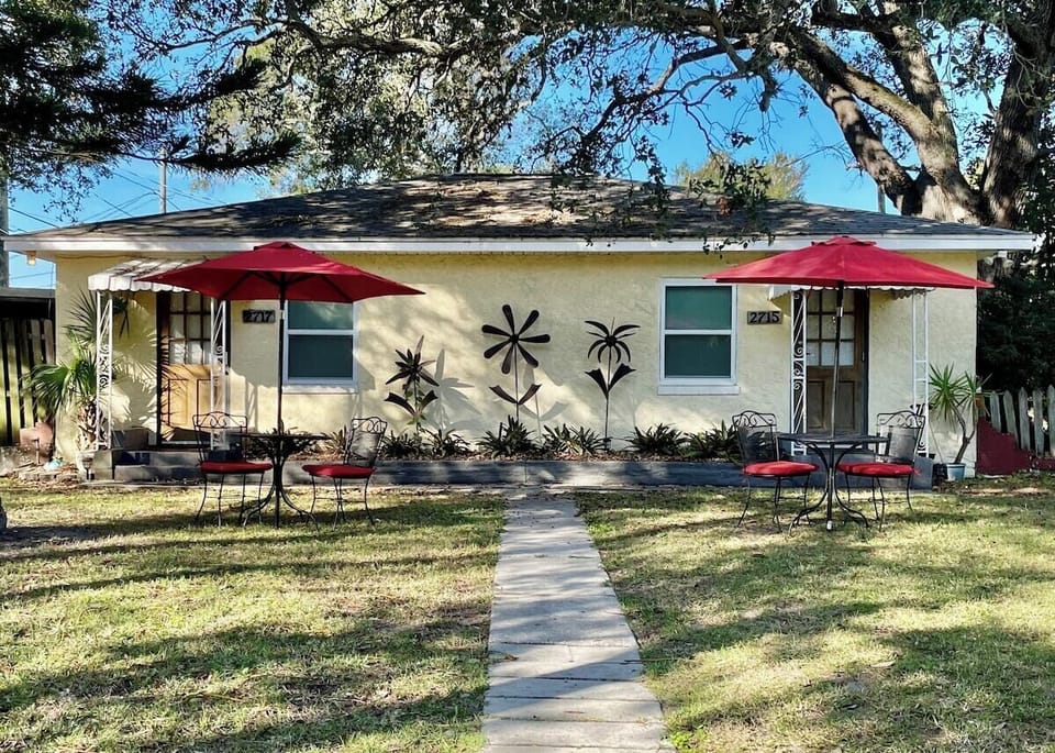 Charming duplex cottage with fun metal art. 