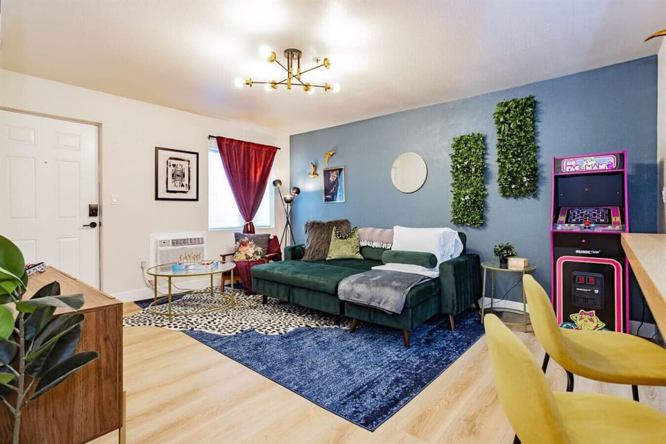 Living Room: Vibrant decor with plush seating and retro gaming for unforgettable relaxation!