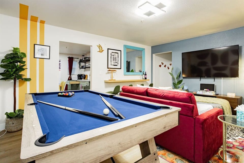 Game Room: Challenge your friends at the vibrant pool table in this lively retreat!