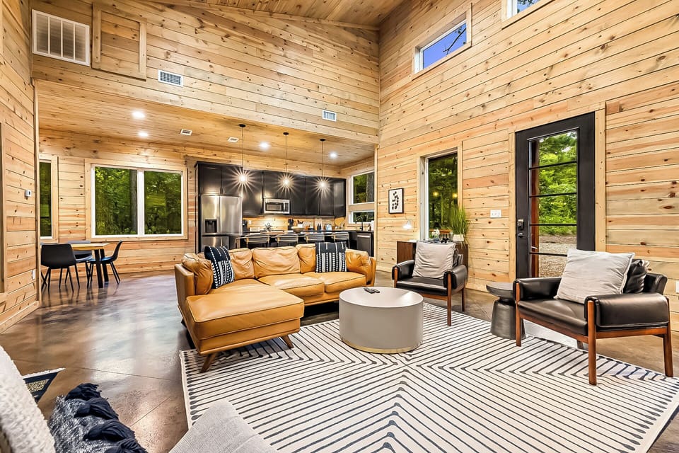 View from the living room into the kitchen, showcasing an open-concept design with modern furnishings.