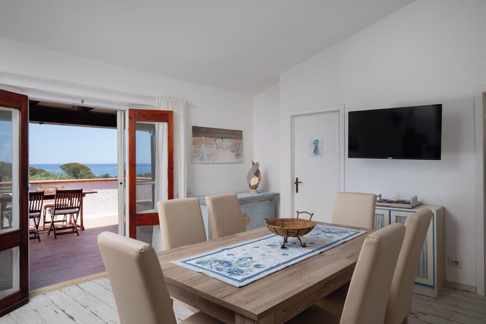 Apartment, Sea View | Living area | 35-inch TV with digital channels