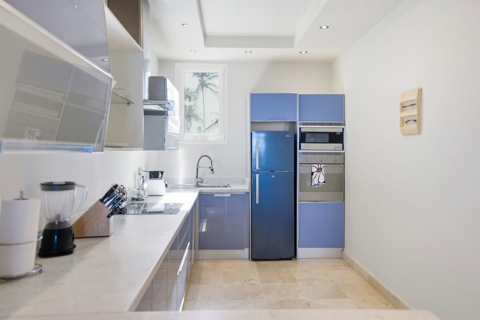 A bright and functional kitchen designed for everyday use, featuring clean lines and a modern layout.