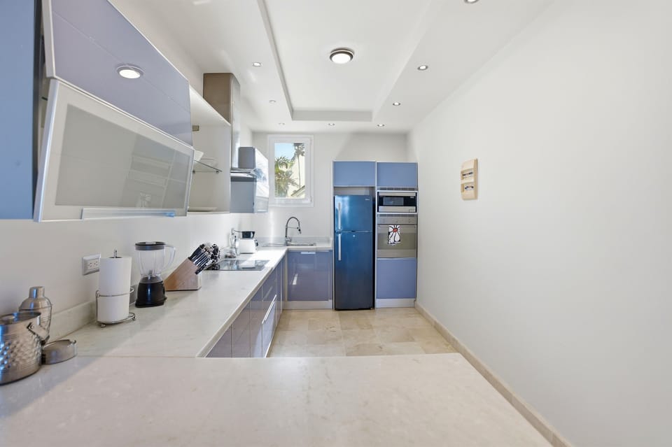 A fully equipped kitchen with modern appliances, ample counter space, and everything you need for cooking comfortably.