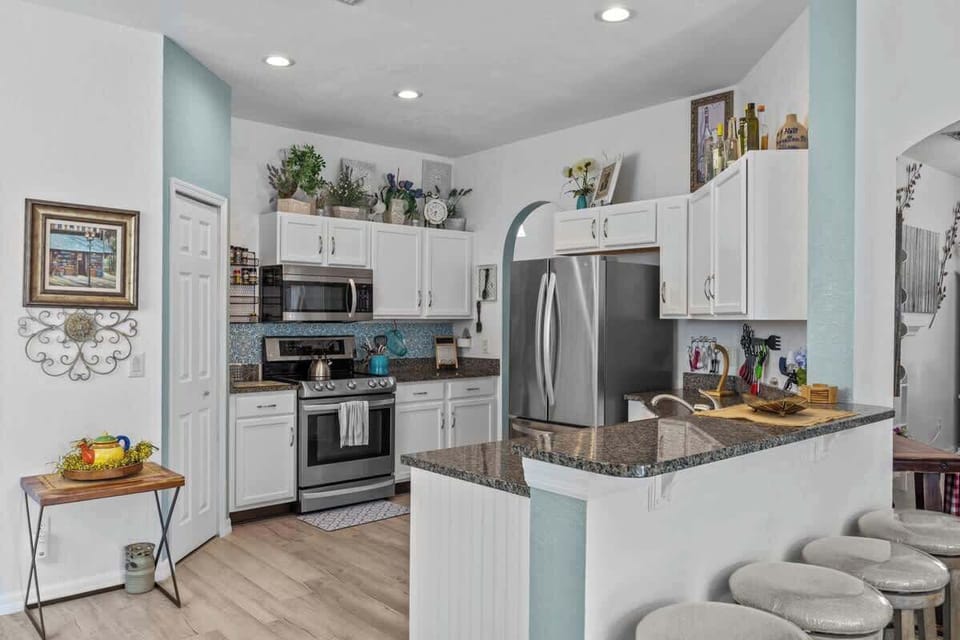 Inside those cabinets are many gadgets & cookware, even a bread maker.  You will probably not want for anything else to complete your meals.
The hardwood floors which are really gray, add a touch of update that make for easier cleaning and beauty.