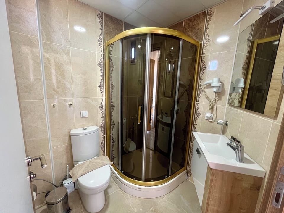 Deluxe Suite, Balcony, Sea View | Bathroom | Shower, free toiletries, hair dryer, slippers