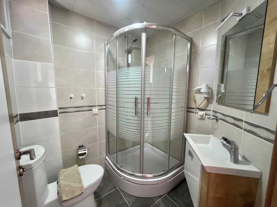 Standard Suite, Balcony, Sea View | Bathroom | Shower, free toiletries, hair dryer, slippers