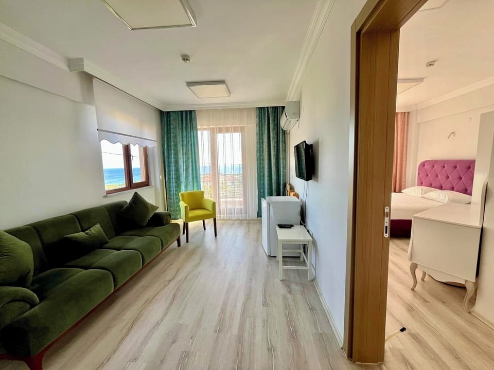 Deluxe Suite, Balcony, Sea View | 1 bedroom, premium bedding, free WiFi, bed sheets