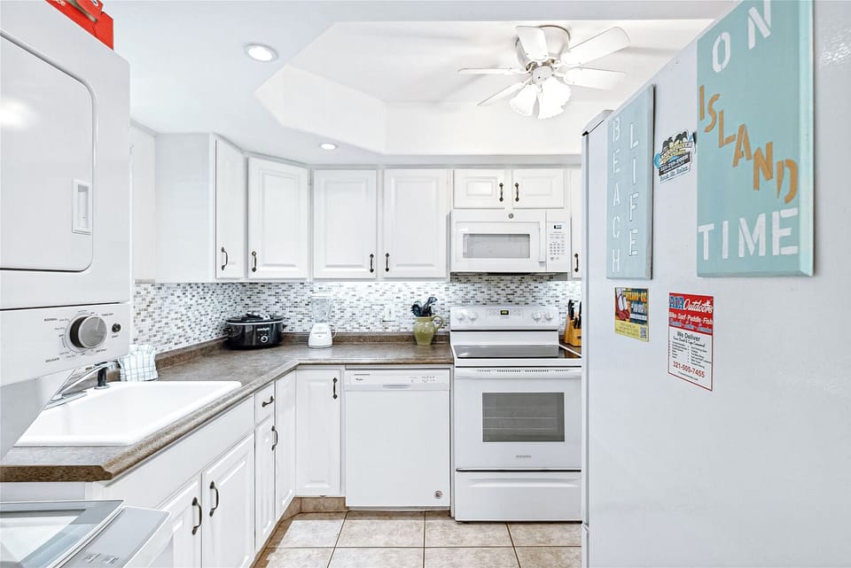 Clean and modern kitchen with white cabinetry and stylish finishes