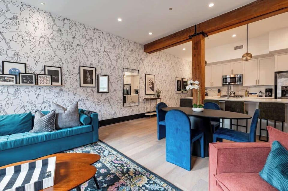 Relax in the living area with a smart TV, stylish seating, and a queen-sized sleeper sofa for extra guests. Perfect for families or group stays in New Orleans, this inviting space is ideal for movie nights or recharging after a day in the city.