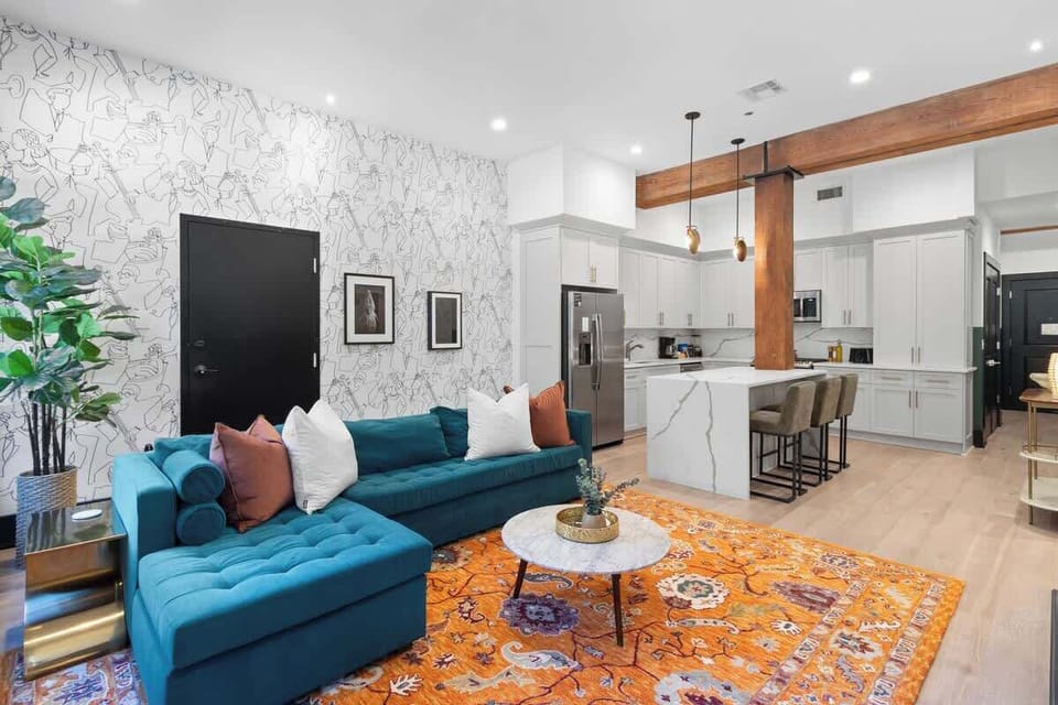 Relax in the living area with a smart TV, stylish seating and a sleeper sofa for extra guests. Perfect for families or group stays in New Orleans, this inviting space is ideal for movie nights or recharging after a day in the city.