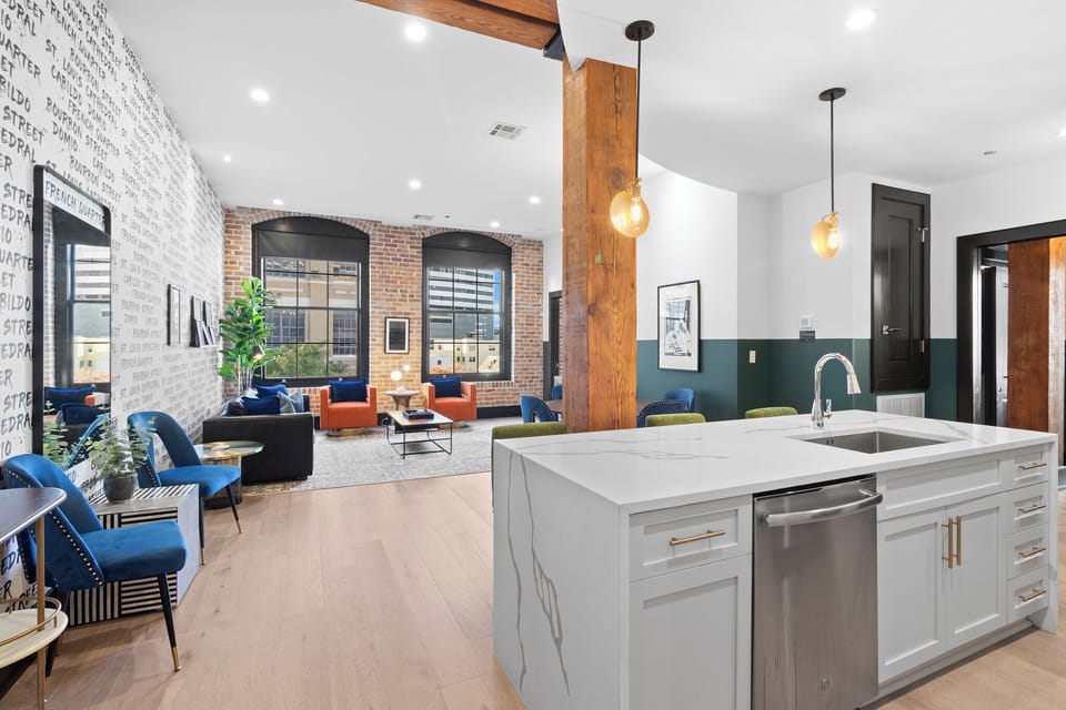 Cook or snack in style with a full kitchen featuring GE stainless appliances, cookware, and an island with bar seating. Ideal for short or extended stays, our kitchens make group travel in New Orleans easy and comfortable.