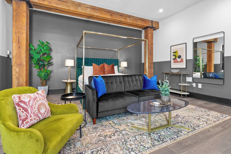 Relax in the living area with a smart TV, stylish seating, and a sleeper sofa for extra guests. Perfect for families or group stays in New Orleans, this inviting space is ideal for movie nights or recharging after a day in the city.