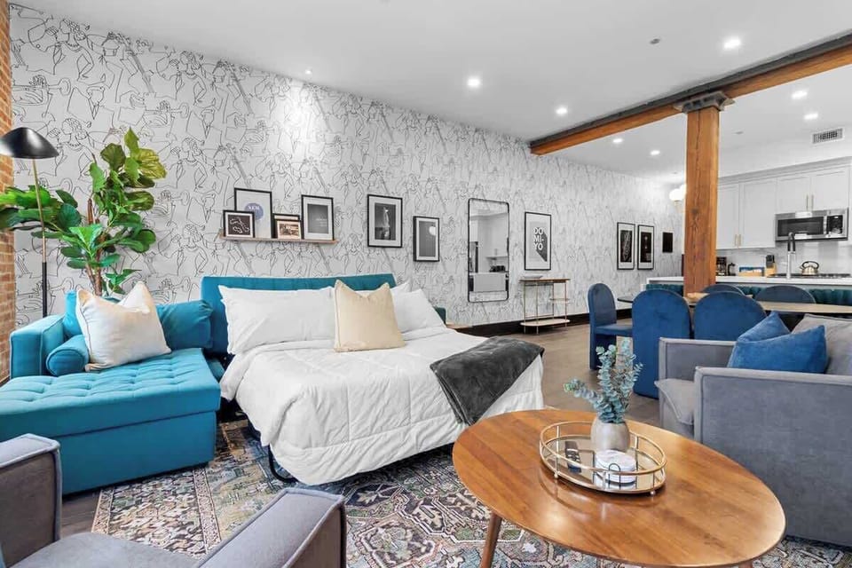 Relax in the living area with a smart TV, stylish seating, and a sleeper sofa for extra guests. Perfect for families or group stays in New Orleans, this inviting space is ideal for movie nights or recharging after a day in the city.