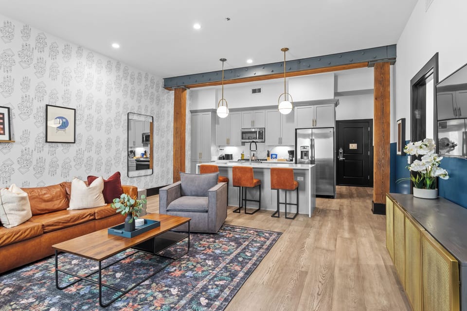 Relax in the living area with a smart TV, stylish seating, and a sleeper sofa for extra guests. Perfect for families or group stays in New Orleans, this inviting space is ideal for movie nights or recharging after a day in the city.
