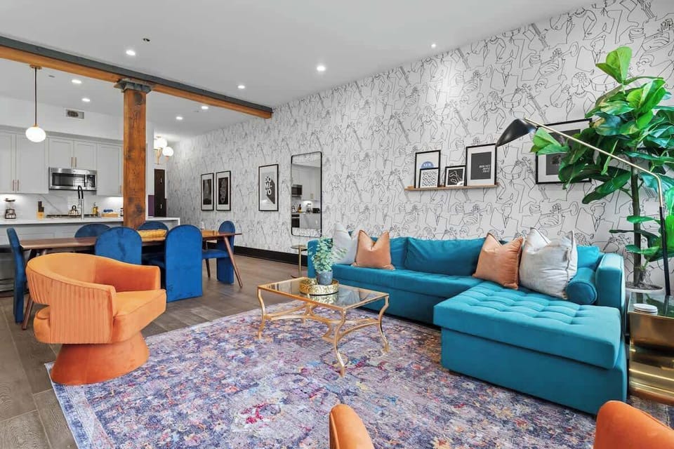 Relax in the living area with a smart TV, stylish seating, and a sleeper sofa for extra guests. Perfect for families or group stays in New Orleans, this inviting space is ideal for movie nights or recharging after a day in the city.