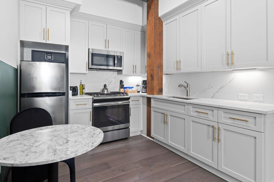 Cook or snack in style with a full kitchen featuring GE stainless appliances, cookware, and a dining area with two seating. Ideal for short or extended stays, our kitchens make group travel in New Orleans easy and comfortable.