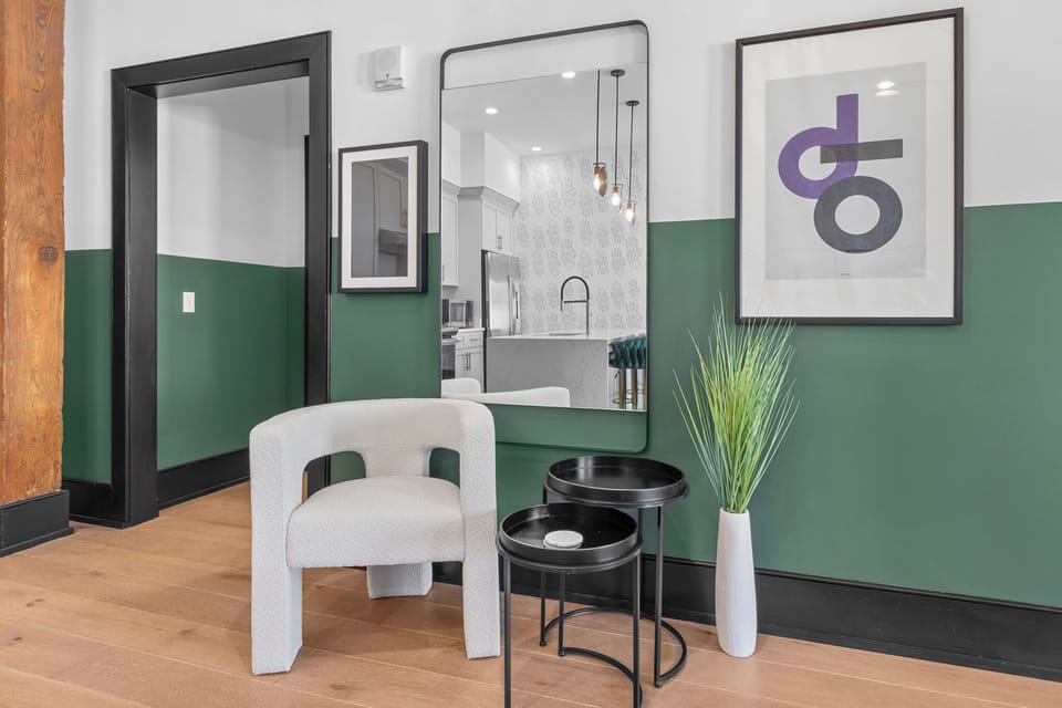 Relax in the living area with a smart TV, stylish seating, and a queen-size sleeper sofa for extra guests. Perfect for families or group stays in New Orleans, this inviting space is ideal for movie nights or recharging after a day in the city.