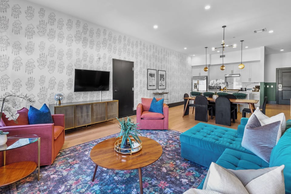 Relax in the living area with a smart TV, stylish seating, and a queen-size sleeper sofa for extra guests. Perfect for families or group stays in New Orleans, this inviting space is ideal for movie nights or recharging after a day in the city.